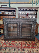 Load image into Gallery viewer, Victorian Ebonised Carved Oak Bookcase With Glazed Doors