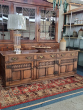 Load image into Gallery viewer, Carved Oak Dresser Base In The Style Of Titchmarsh And Goodwin