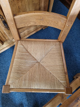 Load image into Gallery viewer, French Oak Farmhouse Extending Dining Table And Chairs With Matching Cupboard - Charlotte Rose Interiors