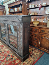 Load image into Gallery viewer, Victorian Ebonised Carved Oak Bookcase With Glazed Doors