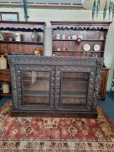 Load image into Gallery viewer, Victorian Ebonised Carved Oak Bookcase With Glazed Doors