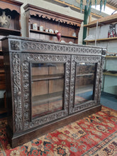 Load image into Gallery viewer, Victorian Ebonised Carved Oak Bookcase With Glazed Doors