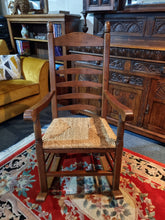 Load image into Gallery viewer, Solid Oak Rocking Chair With Rush Seat - Charlotte Rose Interiors