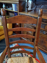 Load image into Gallery viewer, Solid Oak Rocking Chair With Rush Seat - Charlotte Rose Interiors