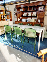 Load image into Gallery viewer, White Extending Dining Table In Metal And Glass With Six Green Perspex Dining Chairs