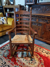 Load image into Gallery viewer, Solid Oak Rocking Chair With Rush Seat - Charlotte Rose Interiors
