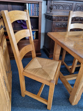 Load image into Gallery viewer, French Oak Farmhouse  Extending Dining Table  And Chairs With Matching Cupboard - Charlotte Rose Interiors
